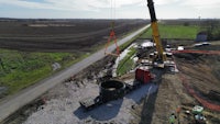 an aerial view of a construction crew working on a construction site