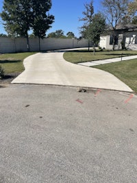 a driveway that has been paved in a residential area